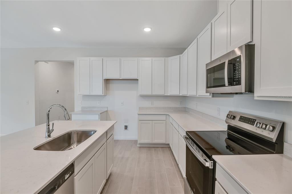 5347 Mickey Avenue Lake Wales, FL 33859 - Photo 8 of 18 a kitchen that has a sink and a stove