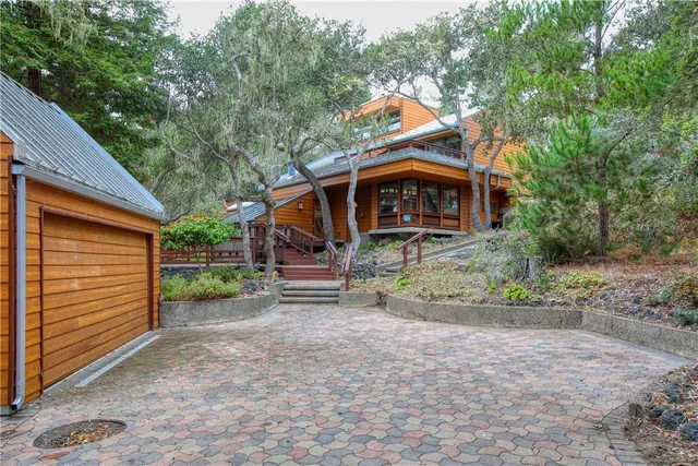 a view of house with outdoor seating area
