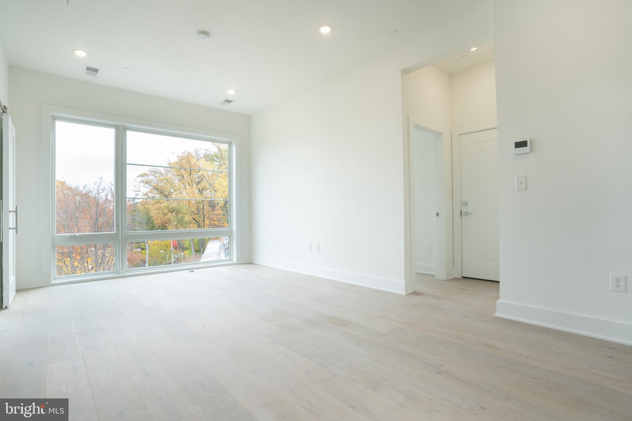 5301 Connecticut Avenue Northwest, Unit 403 Washington, DC 20015 - Photo 5 of 12 a view of an empty room with a window