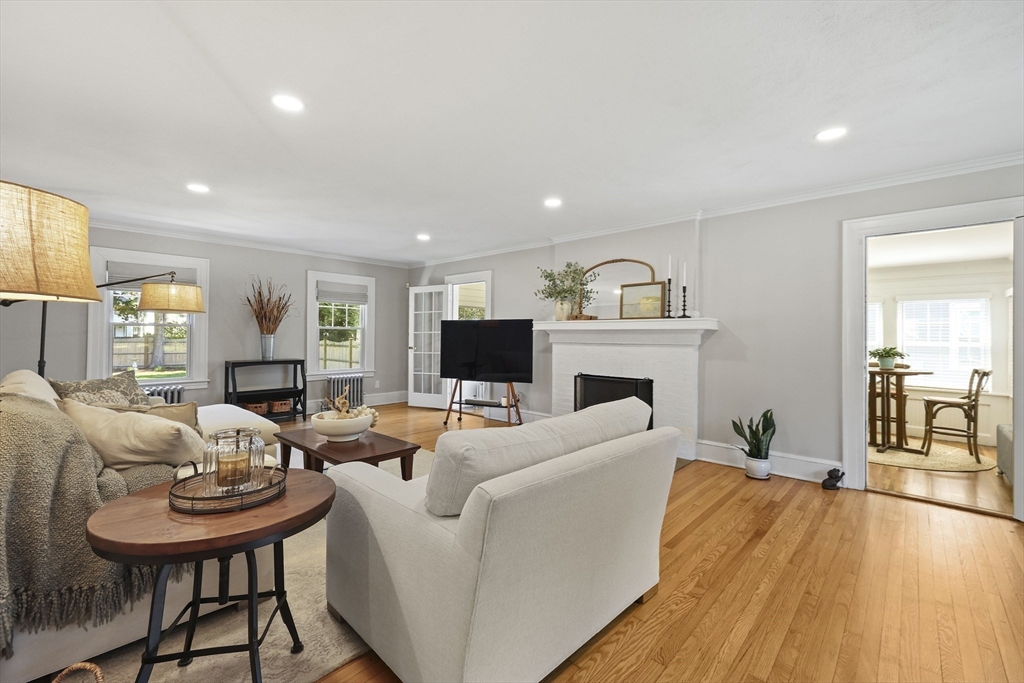 77 Longmeadow Street Longmeadow, MA 01106 - Photo 13 of 41 a living room with furniture a fireplace and a flat screen tv
