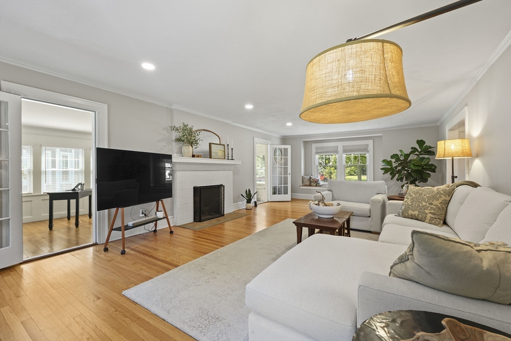 77 Longmeadow Street Longmeadow, MA 01106 - Photo 14 of 41 a living room with furniture a fireplace and a flat screen tv