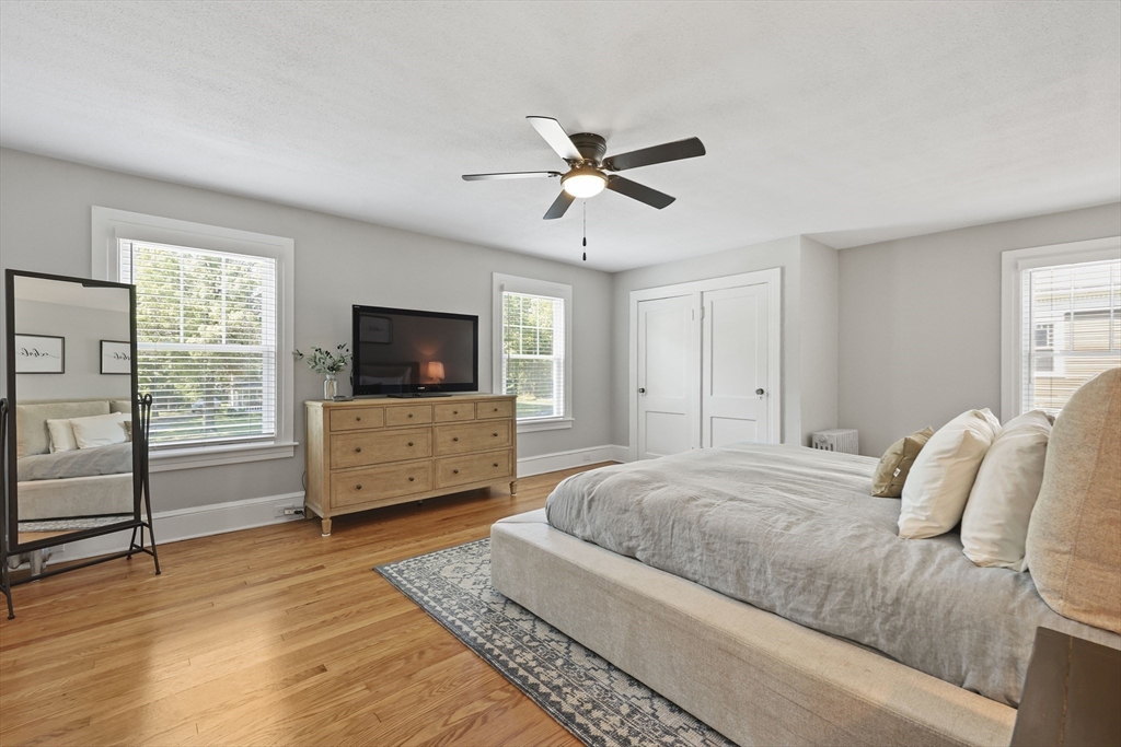 77 Longmeadow Street Longmeadow, MA 01106 - Photo 24 of 41 a bedroom with a bed and a flat screen tv