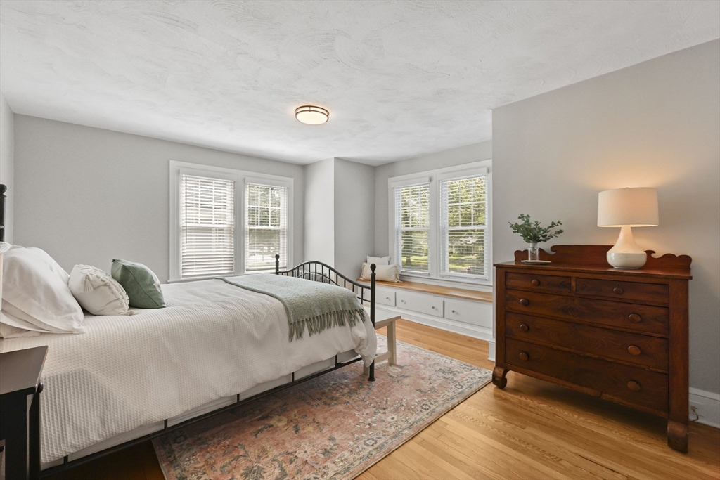 77 Longmeadow Street Longmeadow, MA 01106 - Photo 27 of 41 a bedroom with a bed and wooden floor