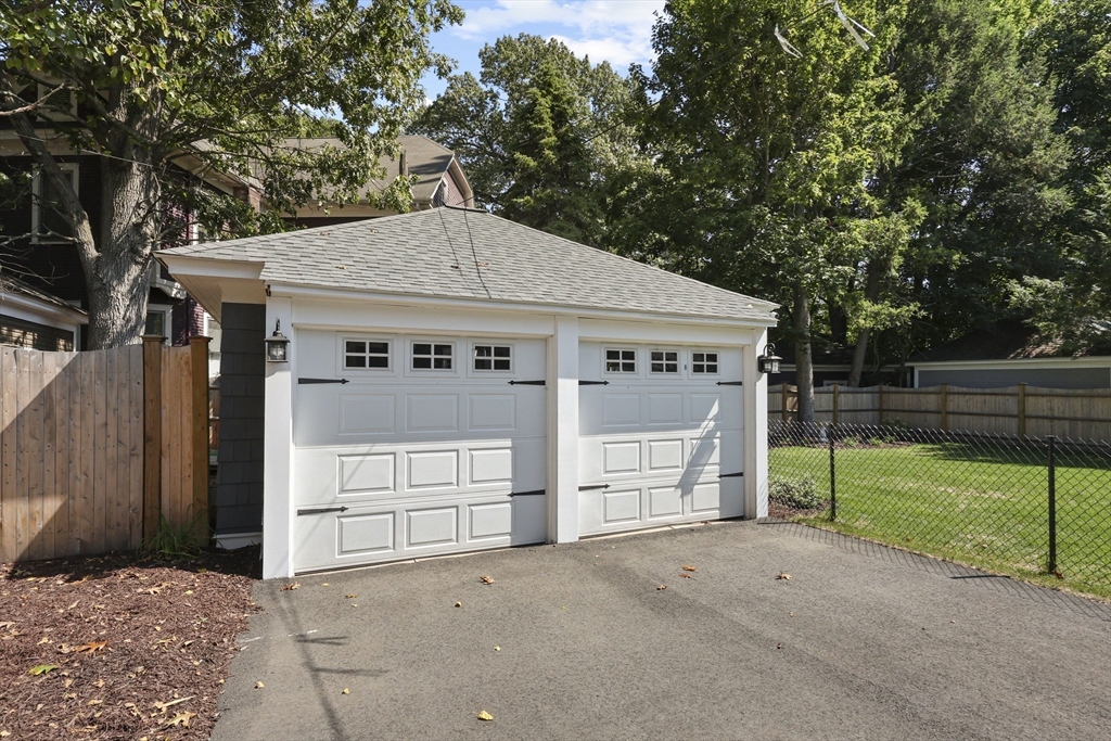 77 Longmeadow Street Longmeadow, MA 01106 - Photo 35 of 41 a view of a house with a yard and garage