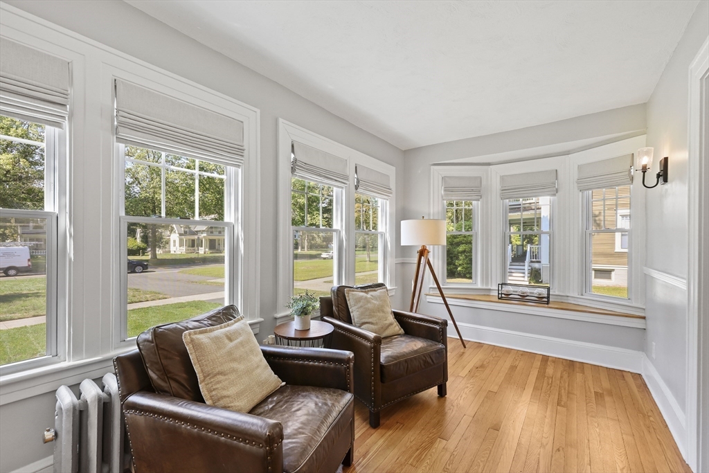 77 Longmeadow Street Longmeadow, MA 01106 - Photo 6 of 41 a living room with furniture and floor to ceiling windows