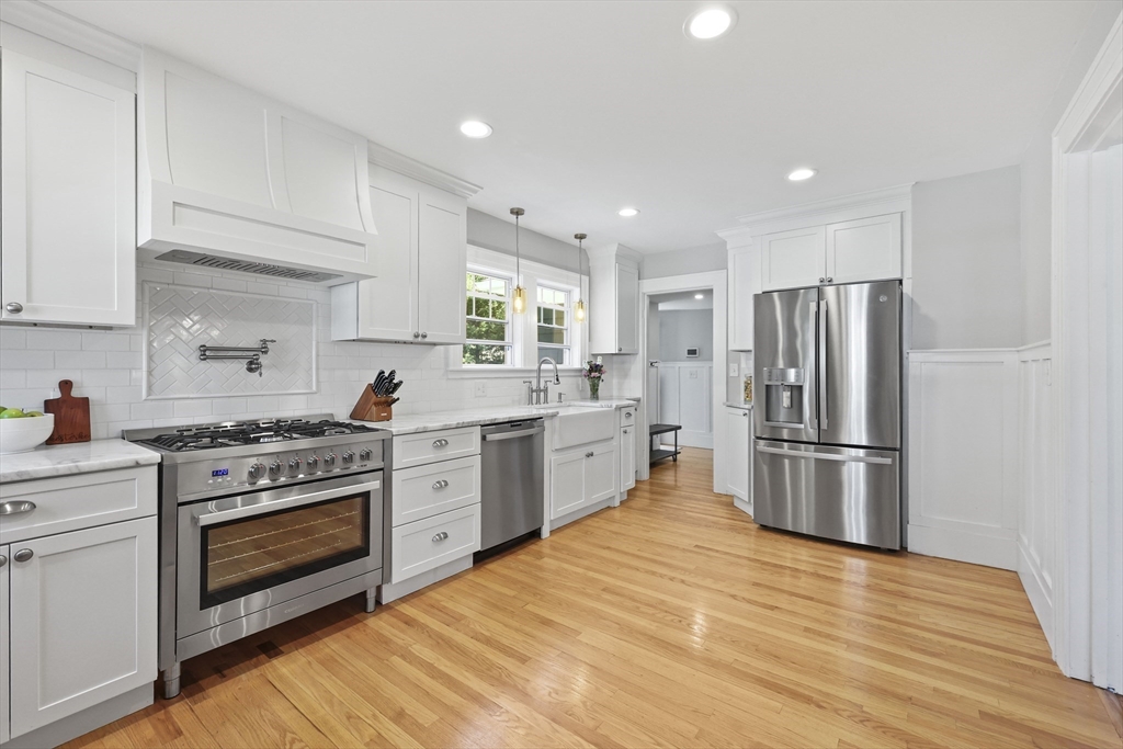 77 Longmeadow Street Longmeadow, MA 01106 - Photo 9 of 41 a kitchen with a stove refrigerator sink and a microwave