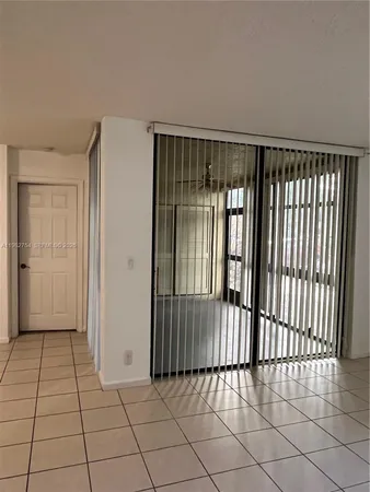 a view of an empty room with a large window