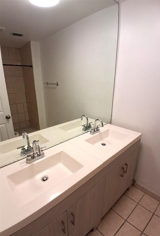 2718 South University Drive, Unit 17B Fort Lauderdale, FL 33328 - Photo 12 of 28 a bathroom with a sink and a mirror