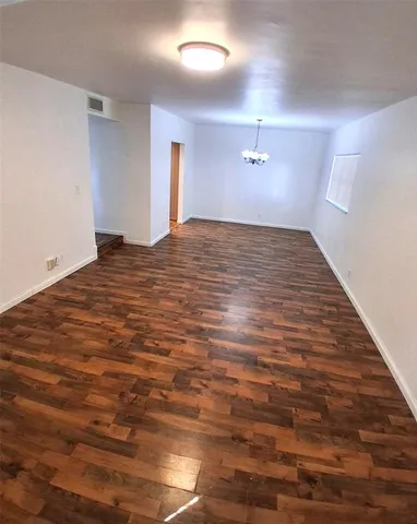a view of a big room with wooden floor