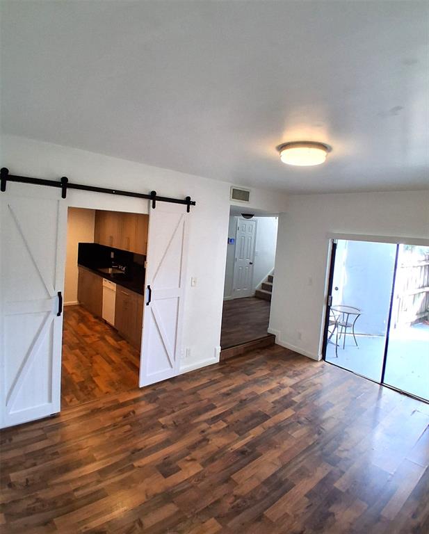 2718 South University Drive, Unit 17B Fort Lauderdale, FL 33328 - Photo 3 of 28 a view of empty room with wooden floor