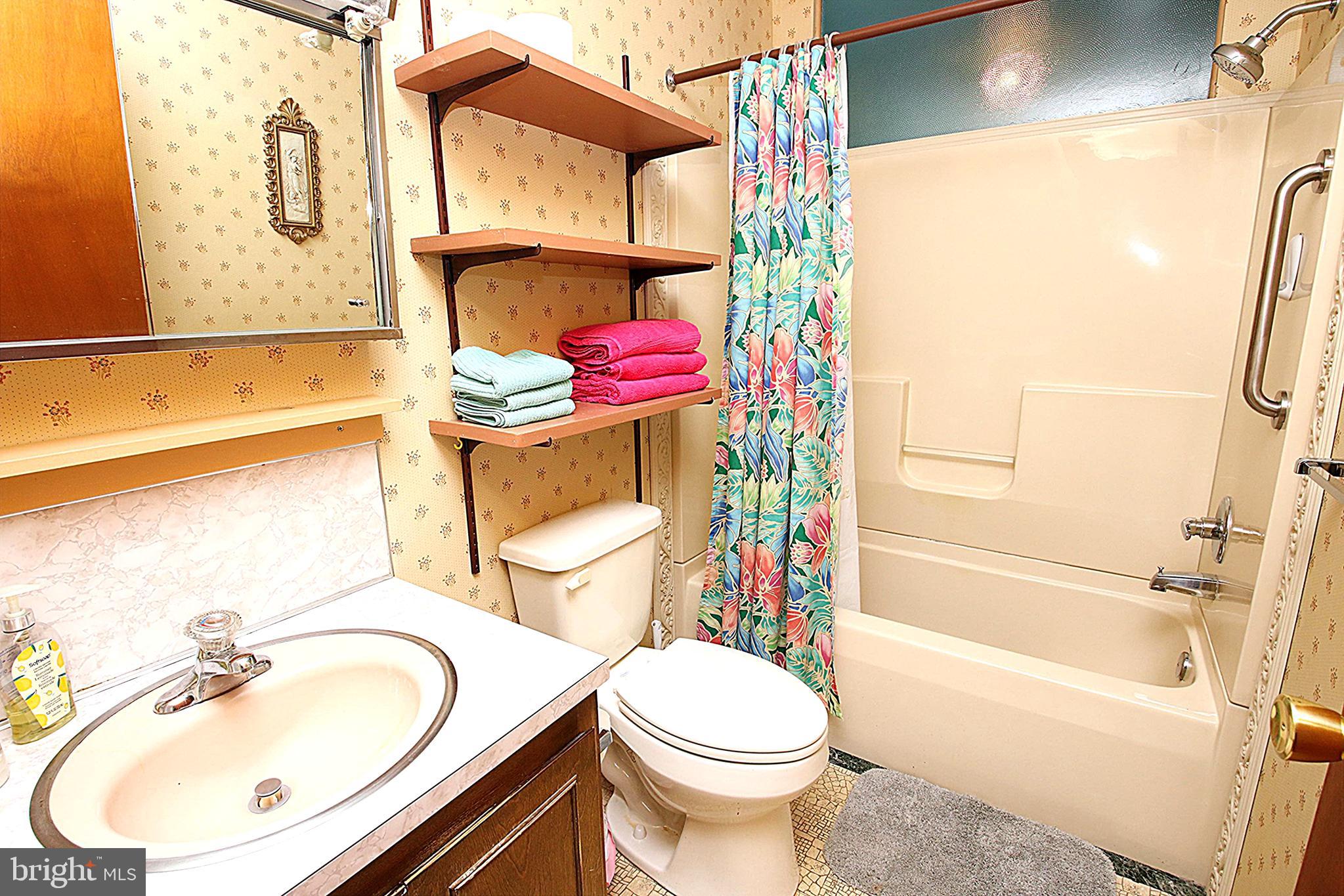 414 Beaver Creek Road Hagerstown, MD 21740 - Photo 14 of 33 a bathroom with a sink toilet and shower