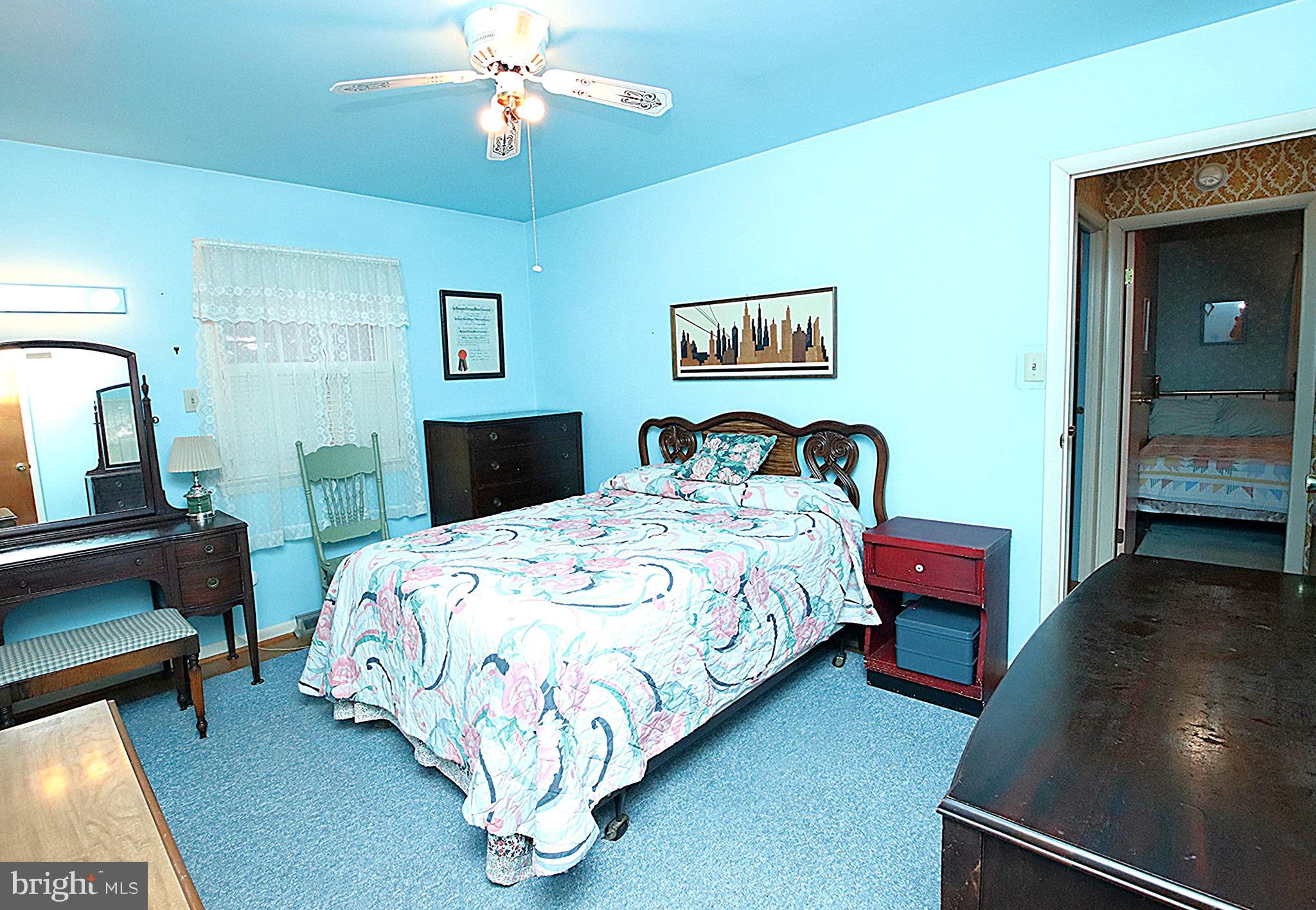 414 Beaver Creek Road Hagerstown, MD 21740 - Photo 16 of 33 a bedroom with a bed chandelier and a window