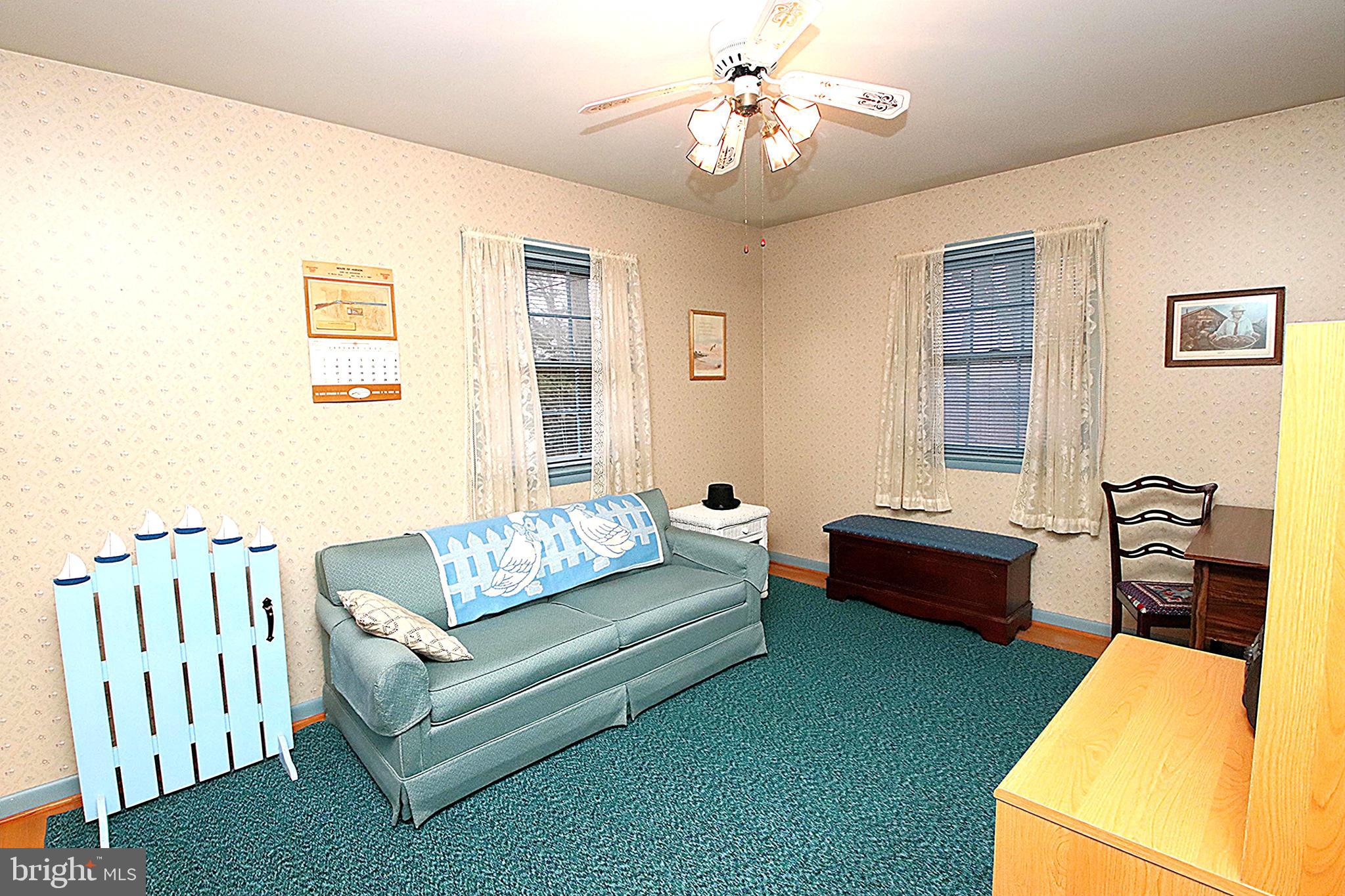 414 Beaver Creek Road Hagerstown, MD 21740 - Photo 17 of 33 a living room with furniture and a chandelier