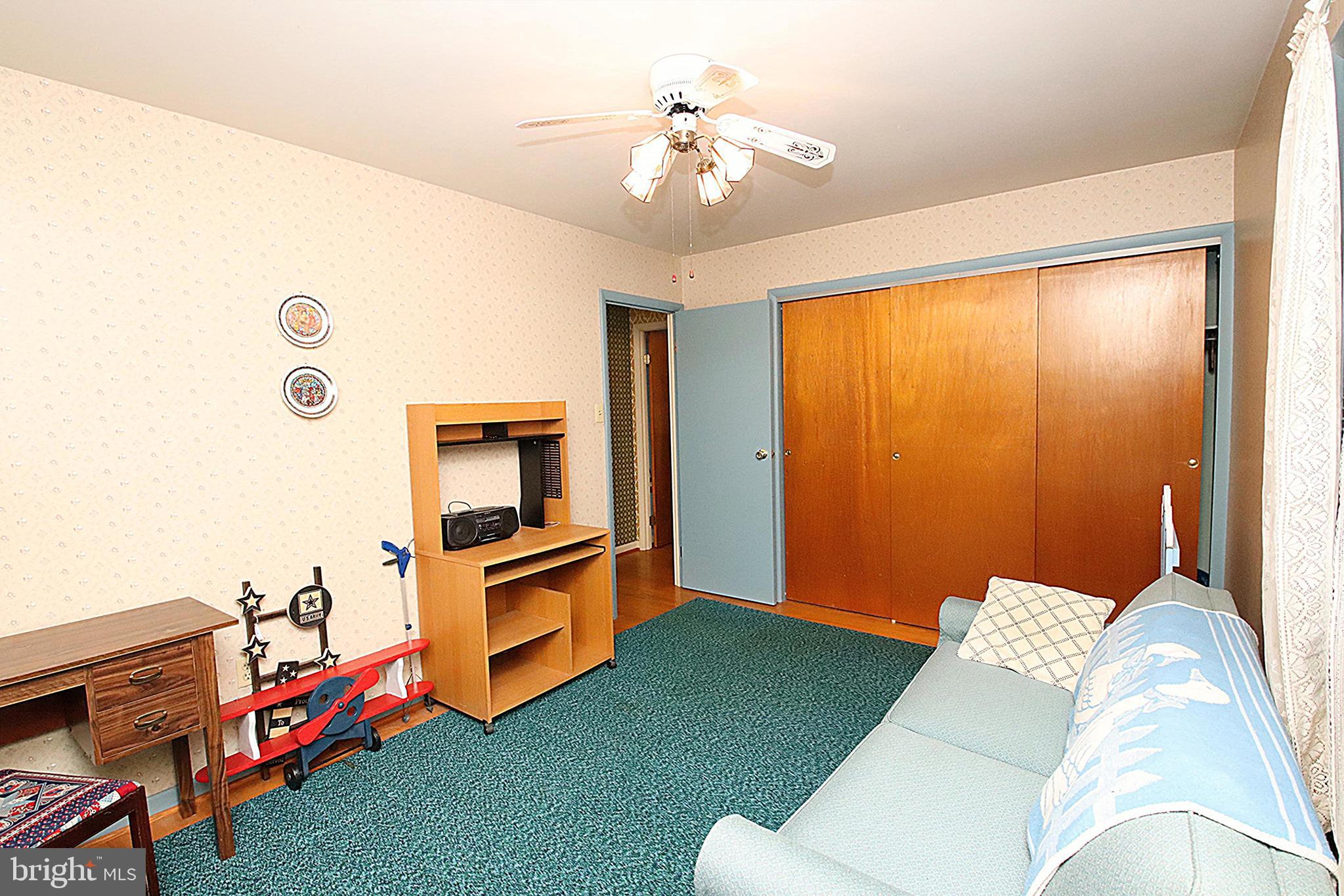 414 Beaver Creek Road Hagerstown, MD 21740 - Photo 18 of 33 a living room with furniture and a chandelier