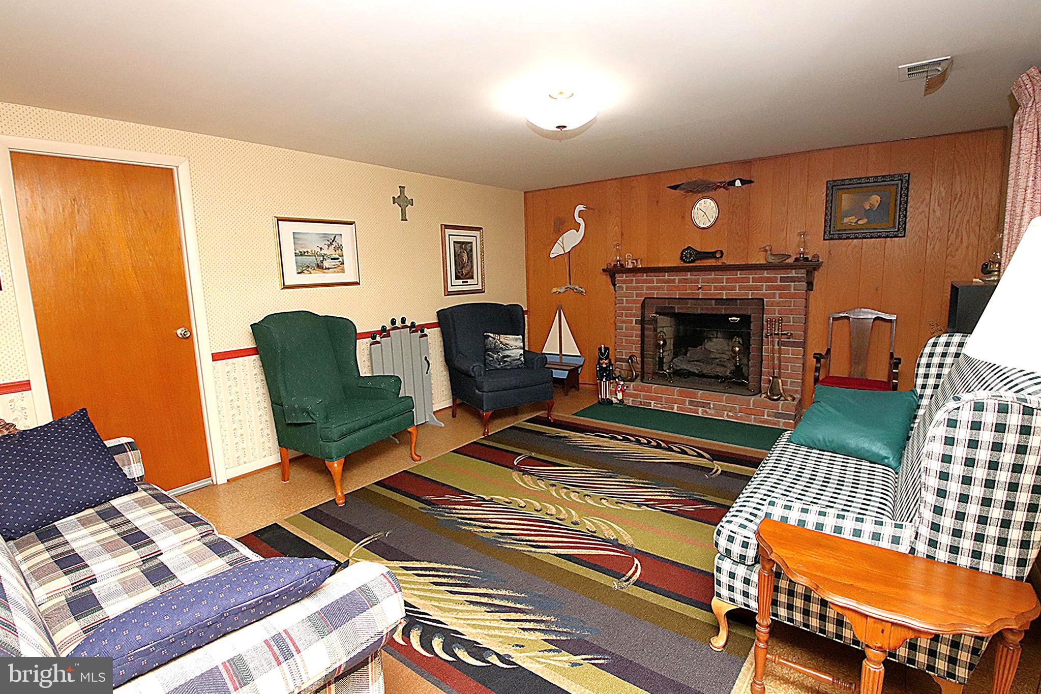 414 Beaver Creek Road Hagerstown, MD 21740 - Photo 21 of 33 a living room with furniture and a fireplace