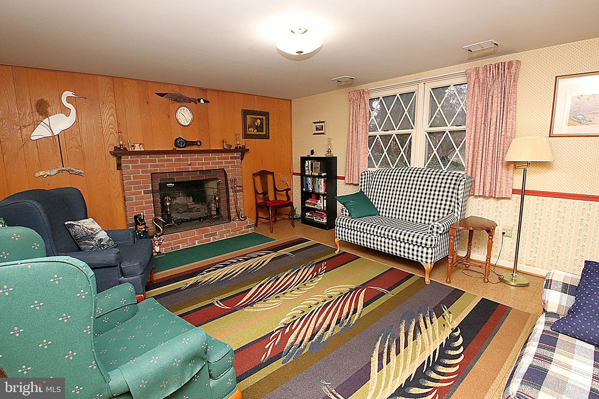 414 Beaver Creek Road Hagerstown, MD 21740 - Photo 22 of 33 a bedroom with furniture and a fireplace