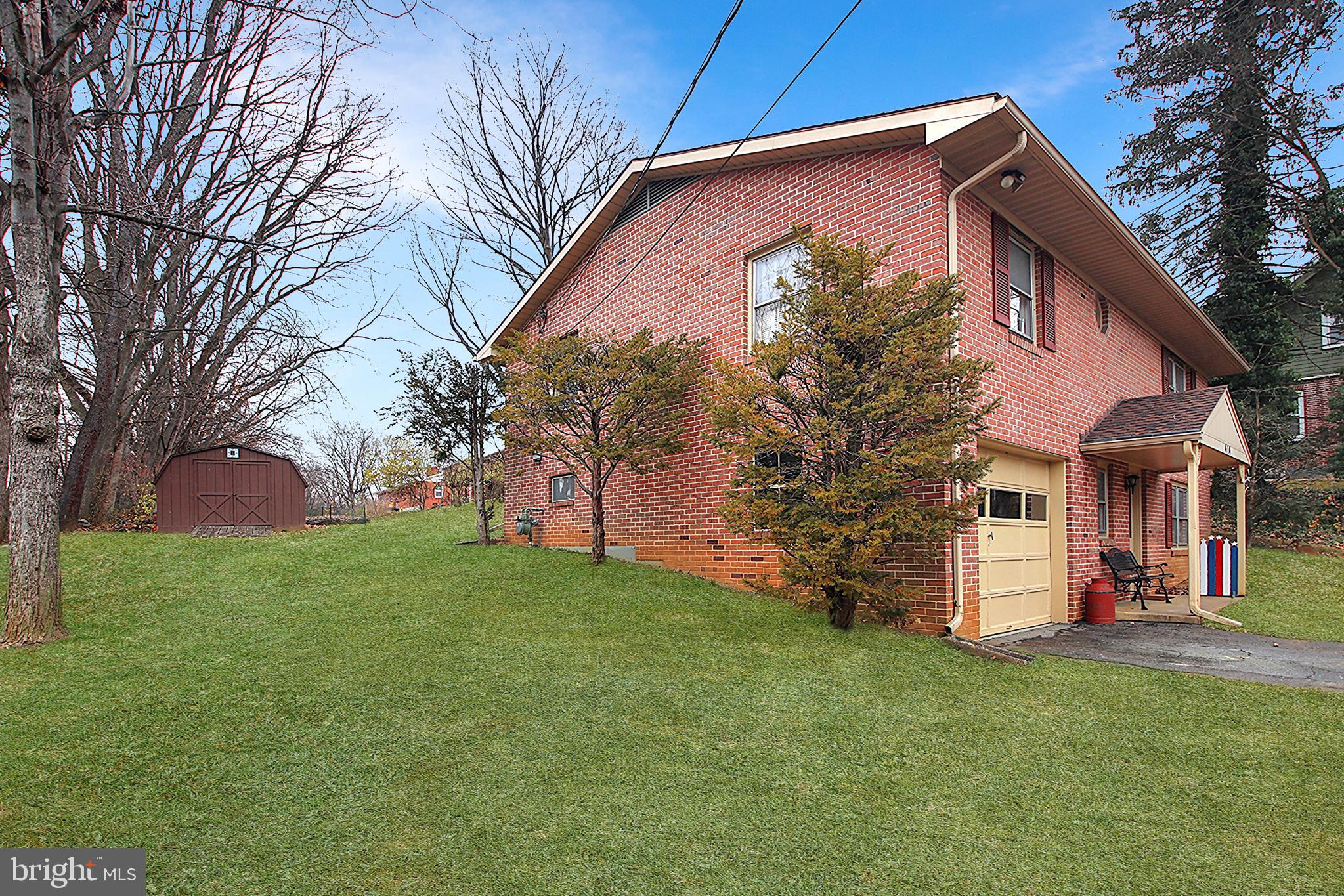 414 Beaver Creek Road Hagerstown, MD 21740 - Photo 30 of 33 a front view of a house with a garden