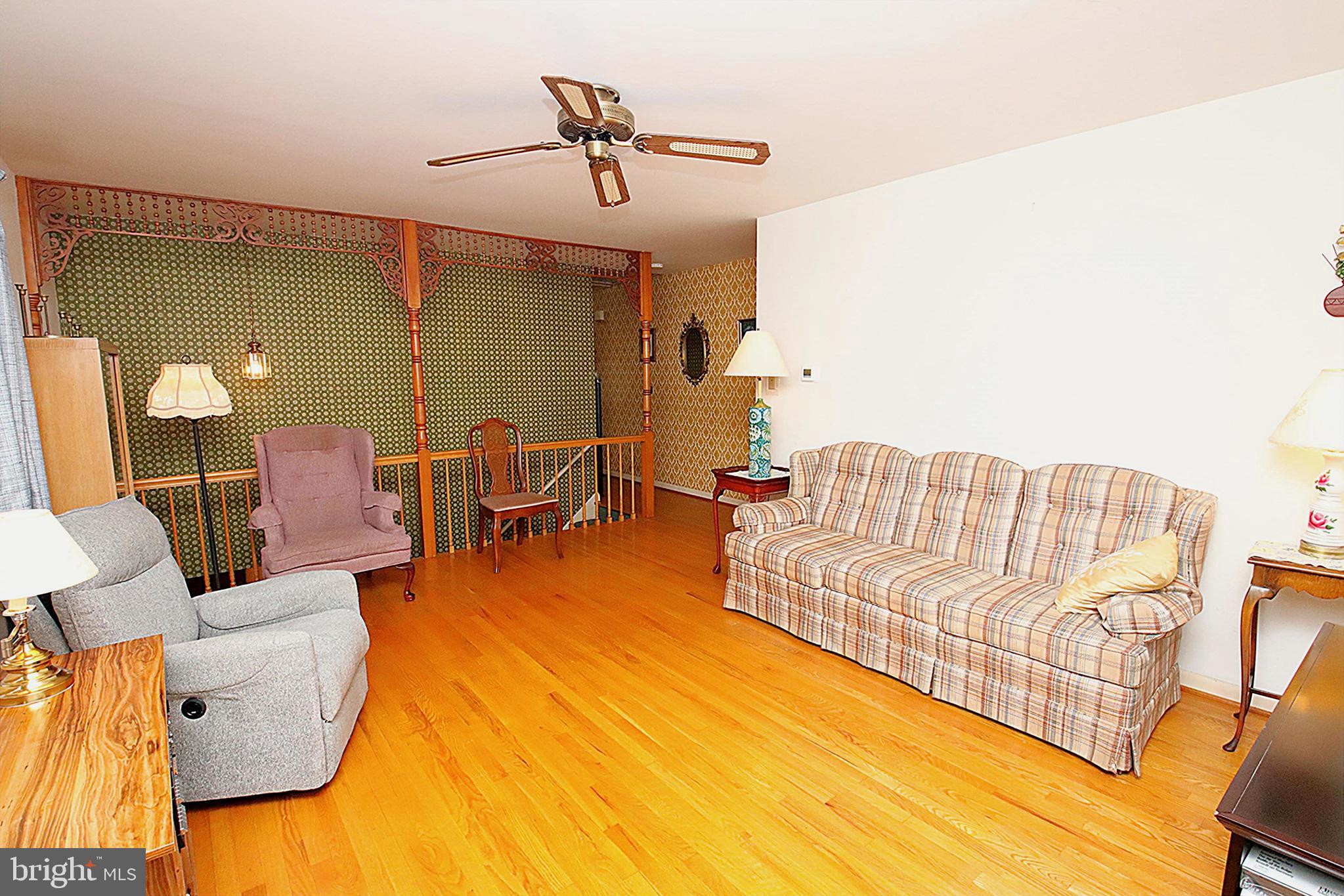 414 Beaver Creek Road Hagerstown, MD 21740 - Photo 6 of 33 a living room with furniture and a wooden floor