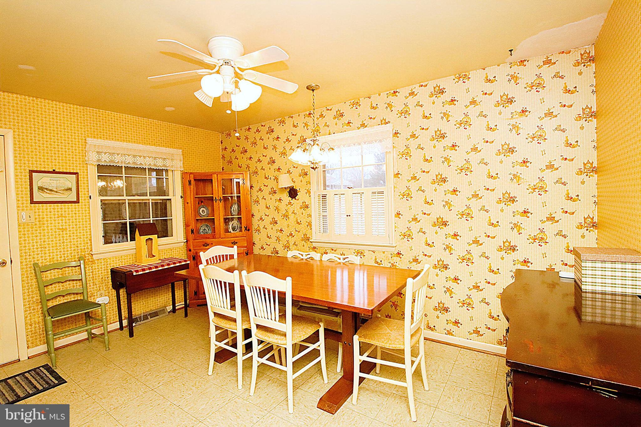 414 Beaver Creek Road Hagerstown, MD 21740 - Photo 9 of 33 a dining room with a table and chairs