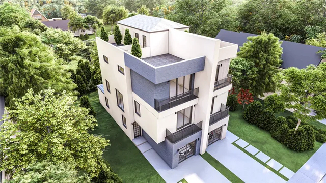 an aerial view of a house with a yard