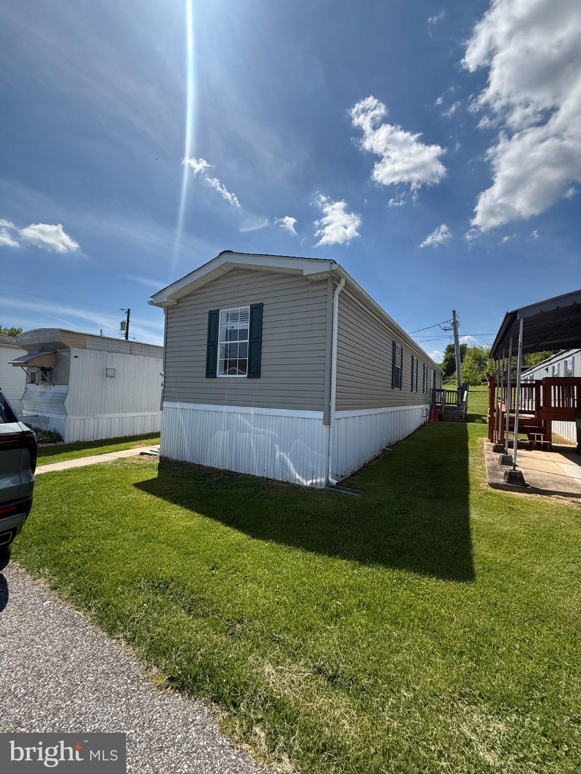 1121 South Old Philadelphia Road Rockville, MD 20850 - Photo 2 of 9 Charming mobile home under sunny skies.