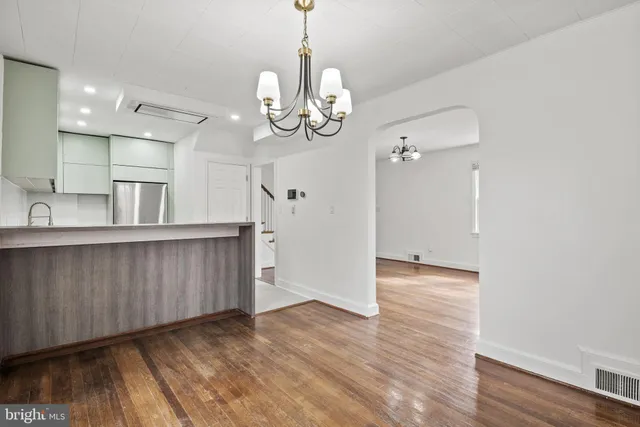 a view of kitchen and wooden floor