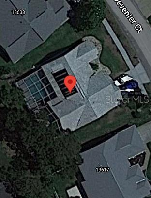 13625 Deventer Court Hudson, FL 34667 - Photo 14 of 14 an aerial view of a yard