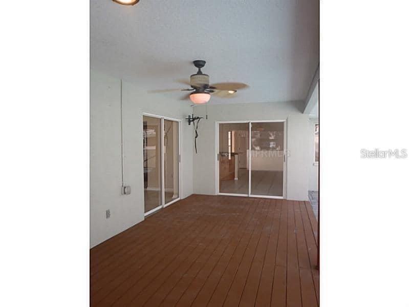 13625 Deventer Court Hudson, FL 34667 - Photo 6 of 14 a view of a livingroom with a ceiling fan