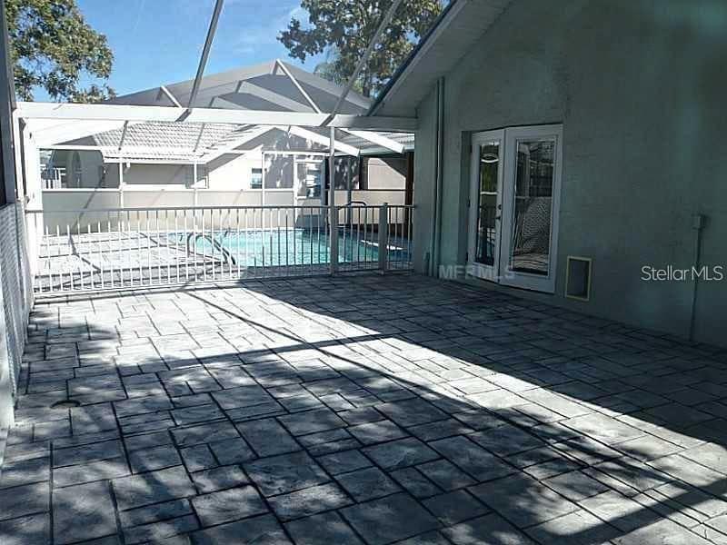 13625 Deventer Court Hudson, FL 34667 - Photo 7 of 14 a view of a backyard with a small deck