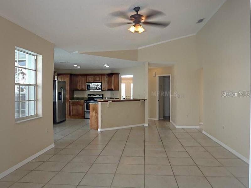 13625 Deventer Court Hudson, FL 34667 - Photo 8 of 14 a view of kitchen with windows and refrigerator