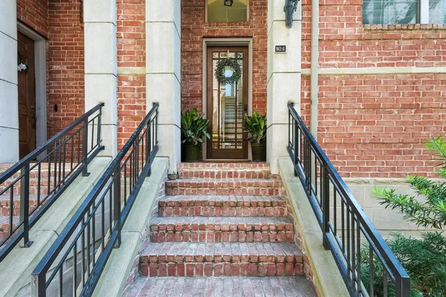 a view of a balcony with wooden floor and stairs
