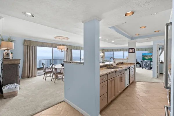 a view of a pathway both side of building with yard