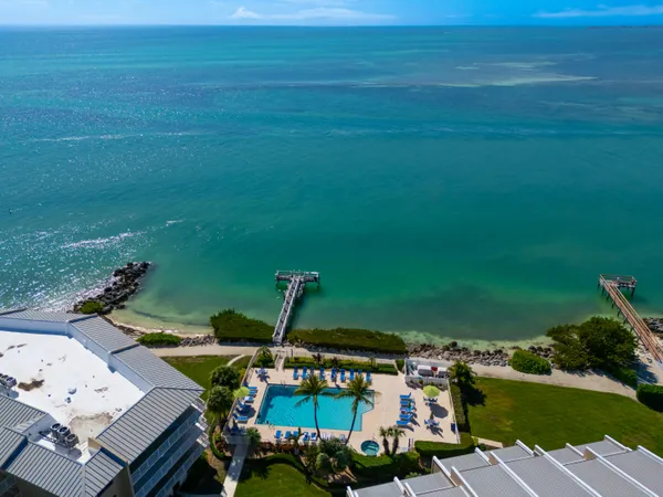 a view of a dining room and livingroom with furniture
