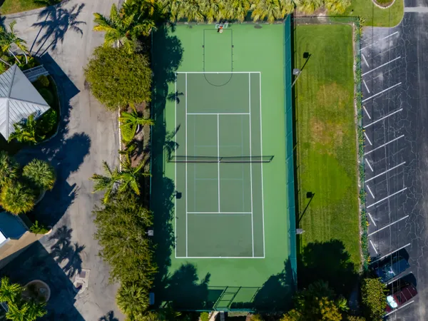 a kitchen with granite countertop a sink and a refrigerator