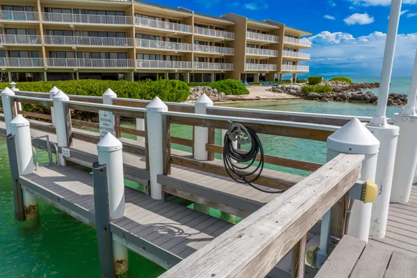 an aerial view of a residential building and trees