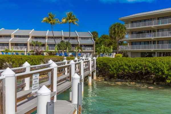 a view of a lake with boats and trees