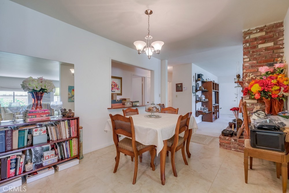 4329 Canyon Crest Road Altadena, CA 91001 - Photo 11 of 29 a view of a dining room with furniture and a chandelier