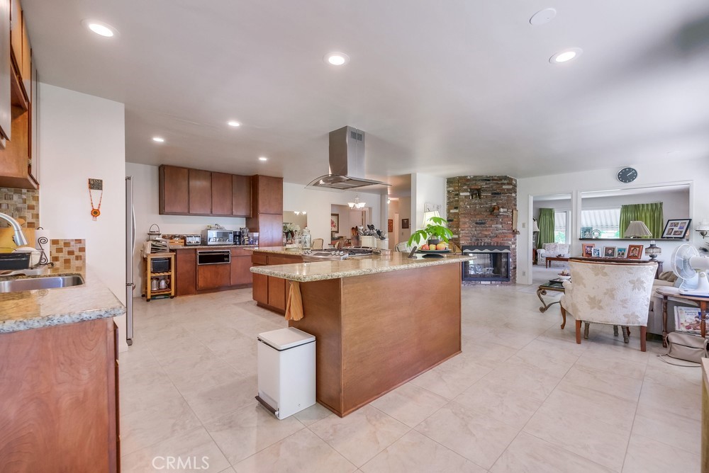 4329 Canyon Crest Road Altadena, CA 91001 - Photo 14 of 29 a living room with kitchen island furniture and a kitchen view