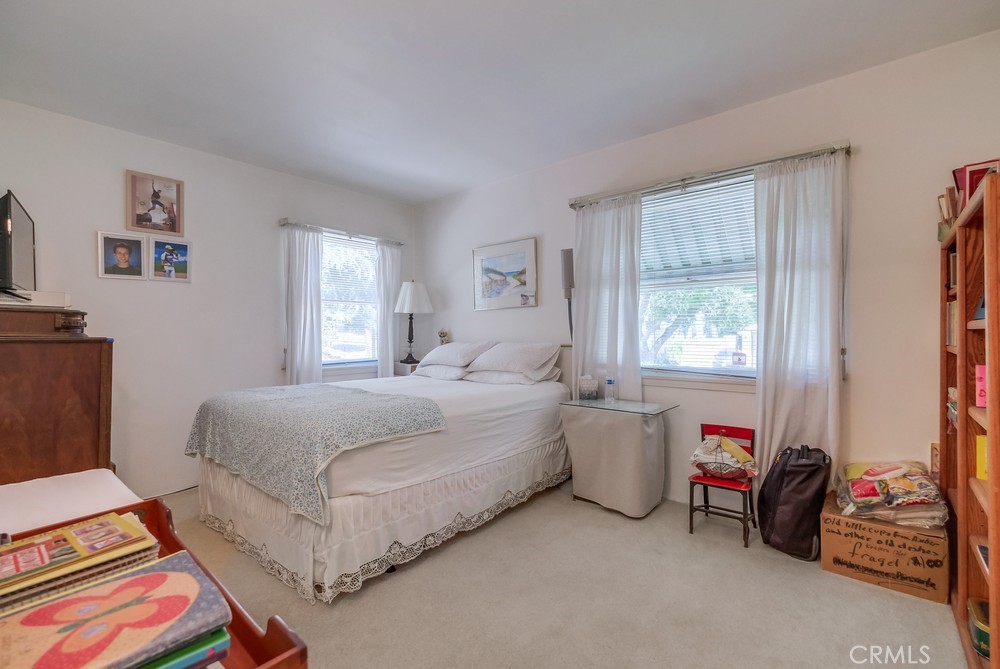 4329 Canyon Crest Road Altadena, CA 91001 - Photo 16 of 29 a bedroom with bed and a window