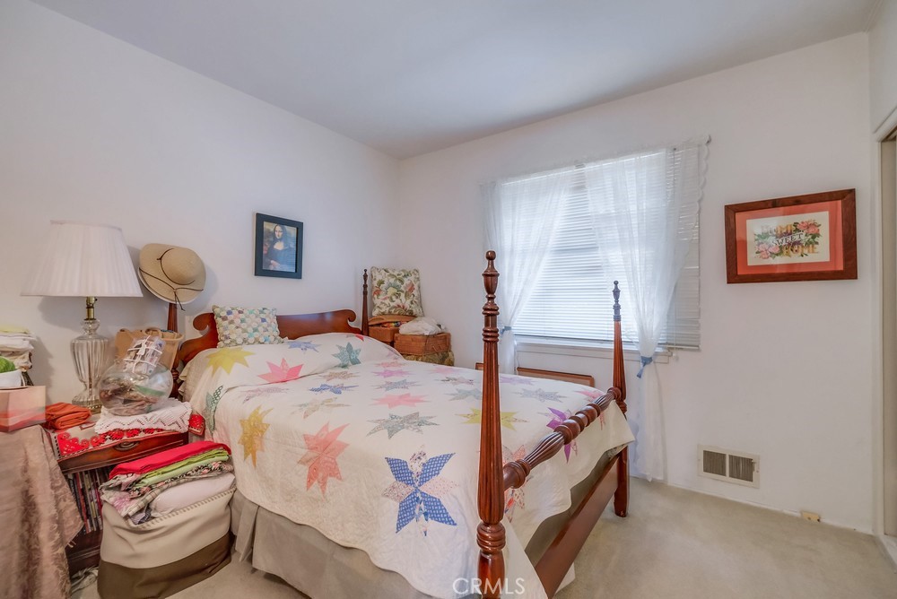 4329 Canyon Crest Road Altadena, CA 91001 - Photo 19 of 29 a bedroom with bed and a painting on the wall