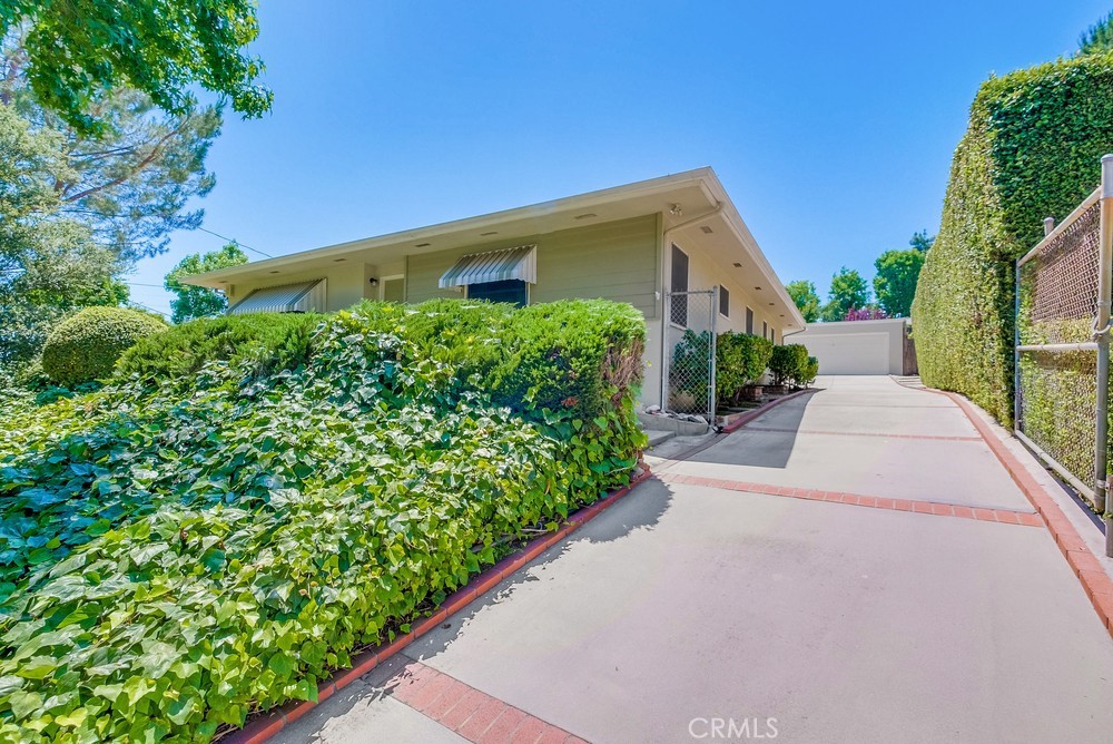 4329 Canyon Crest Road Altadena, CA 91001 - Photo 2 of 29 a front view of a house with a yard