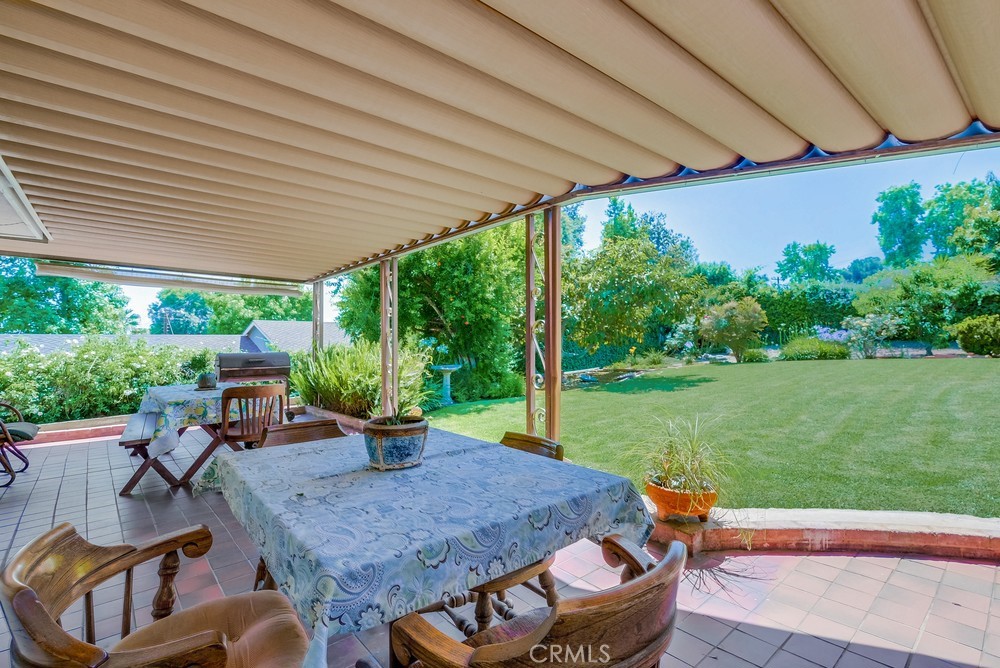 4329 Canyon Crest Road Altadena, CA 91001 - Photo 21 of 29 a backyard of a house with a table and chairs