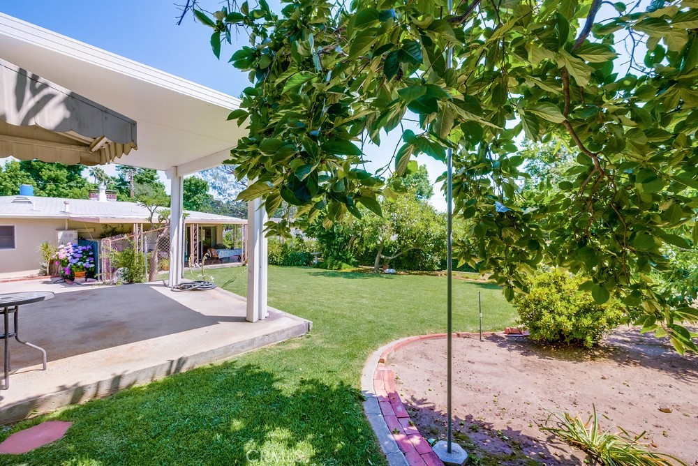4329 Canyon Crest Road Altadena, CA 91001 - Photo 23 of 29 a view of a house with a backyard and a garage