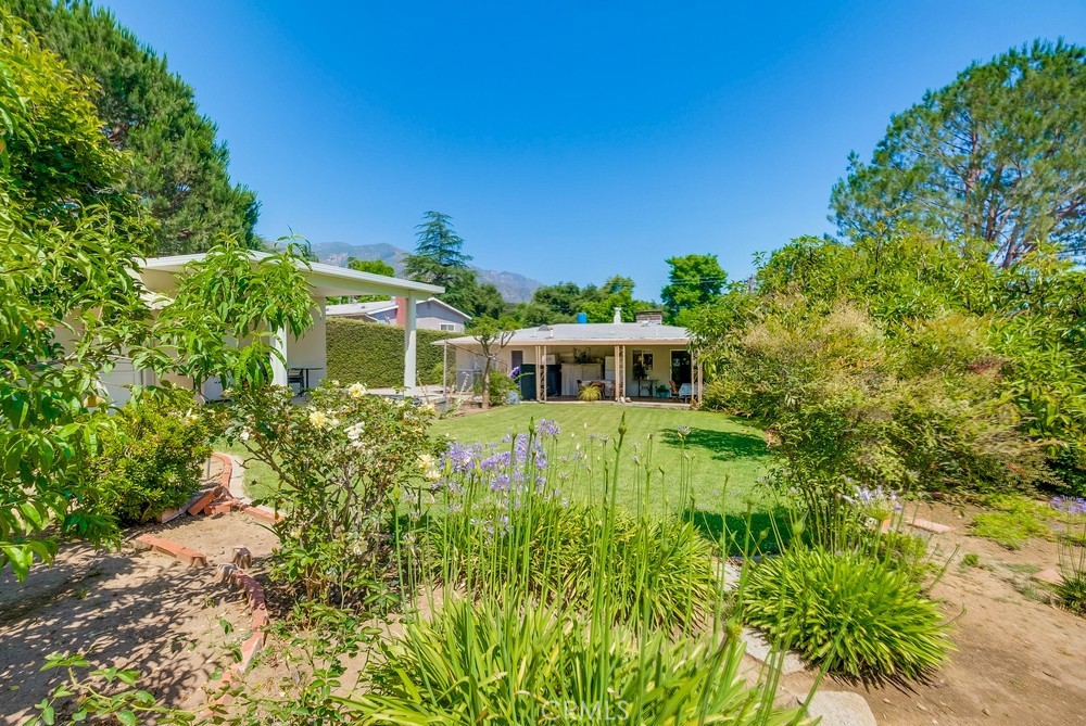 4329 Canyon Crest Road Altadena, CA 91001 - Photo 24 of 29 a front view of a house with a yard