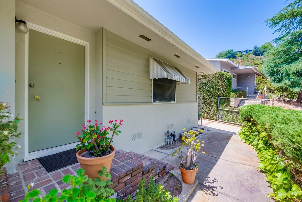 4329 Canyon Crest Road Altadena, CA 91001 - Photo 4 of 29 a front view of a house with a yard