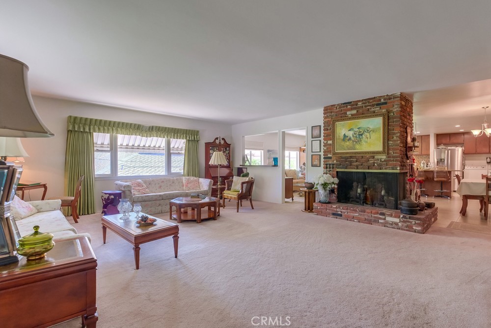 4329 Canyon Crest Road Altadena, CA 91001 - Photo 5 of 29 a living room with furniture a fireplace and a table