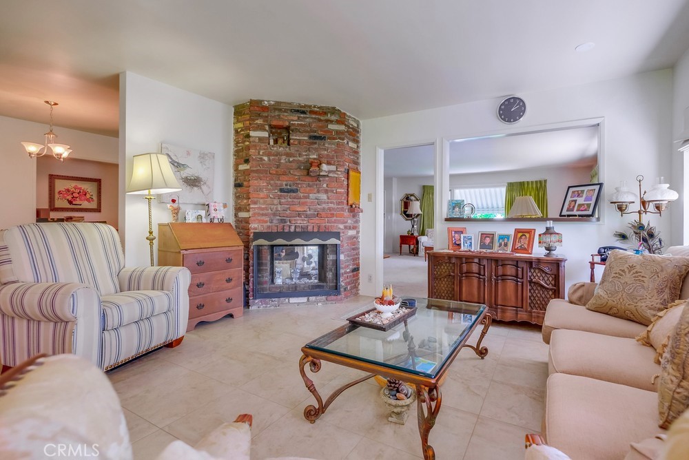 4329 Canyon Crest Road Altadena, CA 91001 - Photo 10 of 29 a living room with furniture and a fireplace