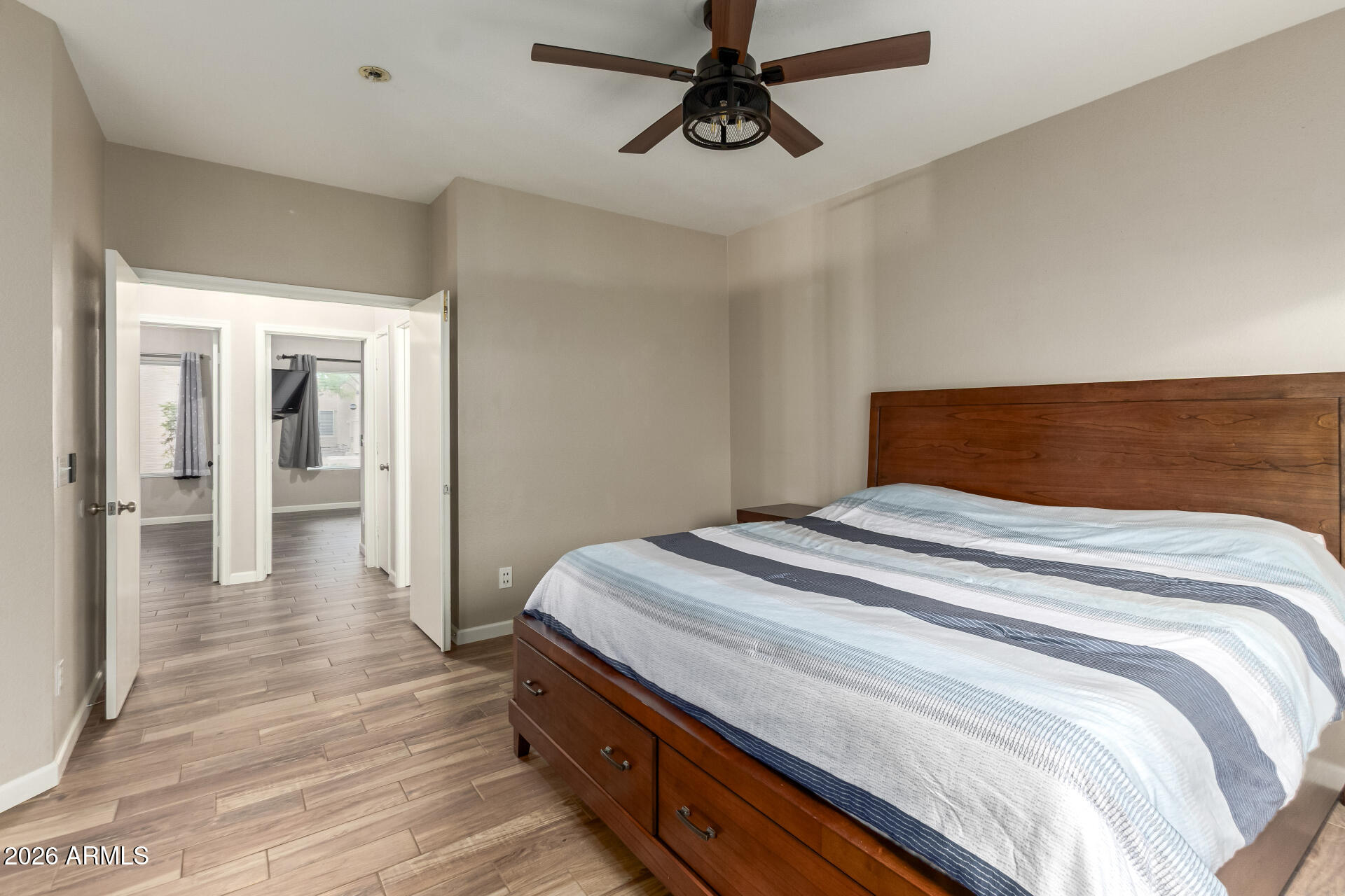 625 North Hamilton Street, Unit 26 Chandler, AZ 85225 - Photo 12 of 25 a bedroom with a bed and wooden floor
