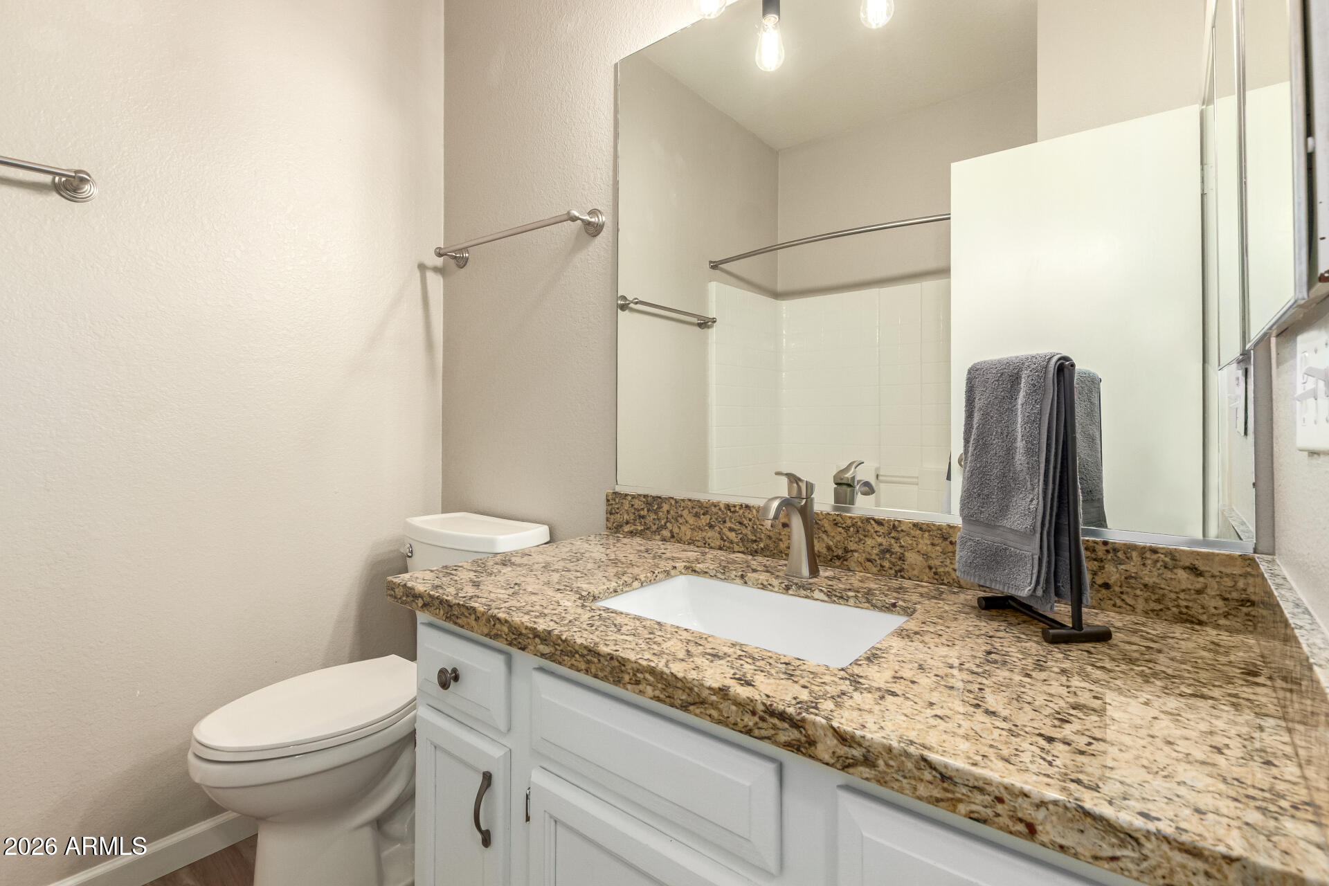 625 North Hamilton Street, Unit 26 Chandler, AZ 85225 - Photo 20 of 25 a bathroom with a granite countertop sink toilet and shower