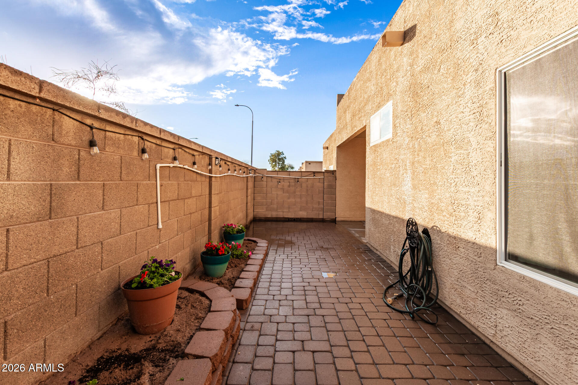 625 North Hamilton Street, Unit 26 Chandler, AZ 85225 - Photo 22 of 25 a view of a porch with potted plants